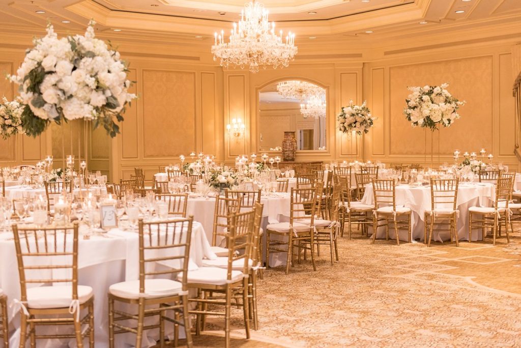 Eau Palm Beach Florida Destination Wedding photos by Mikkel Paige Photography. The luxurious reception was held in the gold ballroom, drenched in white flowers.