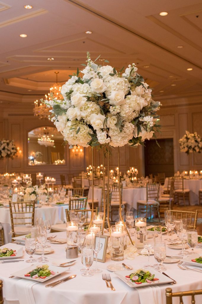 Eau Palm Beach Florida Destination Wedding photos by Mikkel Paige Photography. The luxurious reception was held in the gold ballroom, drenched in white flowers.