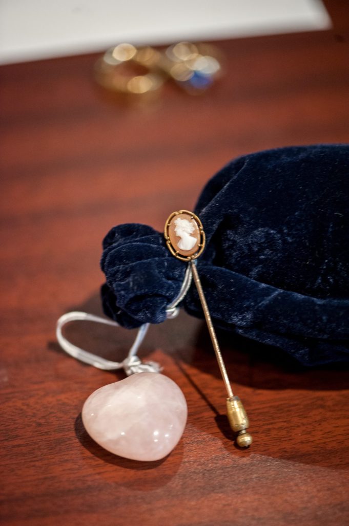 A family heirloom cameo pin for the bribe to wear at her small Brooklyn wedding in NYC during fall with photos by Mikkel Paige Photography.