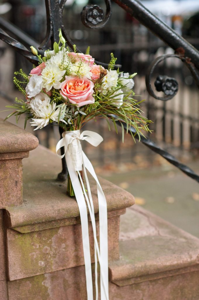 A pink and white bouquet with roses and eucalyptus for a small Brooklyn wedding in NYC during fall with photos by Mikkel Paige Photography.