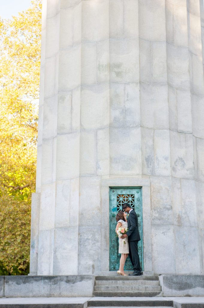 A bride and groom during their small Brooklyn wedding elopement in NYC during Fall. Photos by Mikkel Paige Photography with a ceremony held at Fort Greene Park.