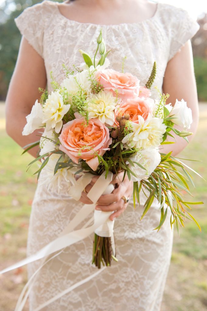 A peach and white bouquet with roses and eucalyptus for a small Brooklyn wedding in NYC during fall with photos by Mikkel Paige Photography.