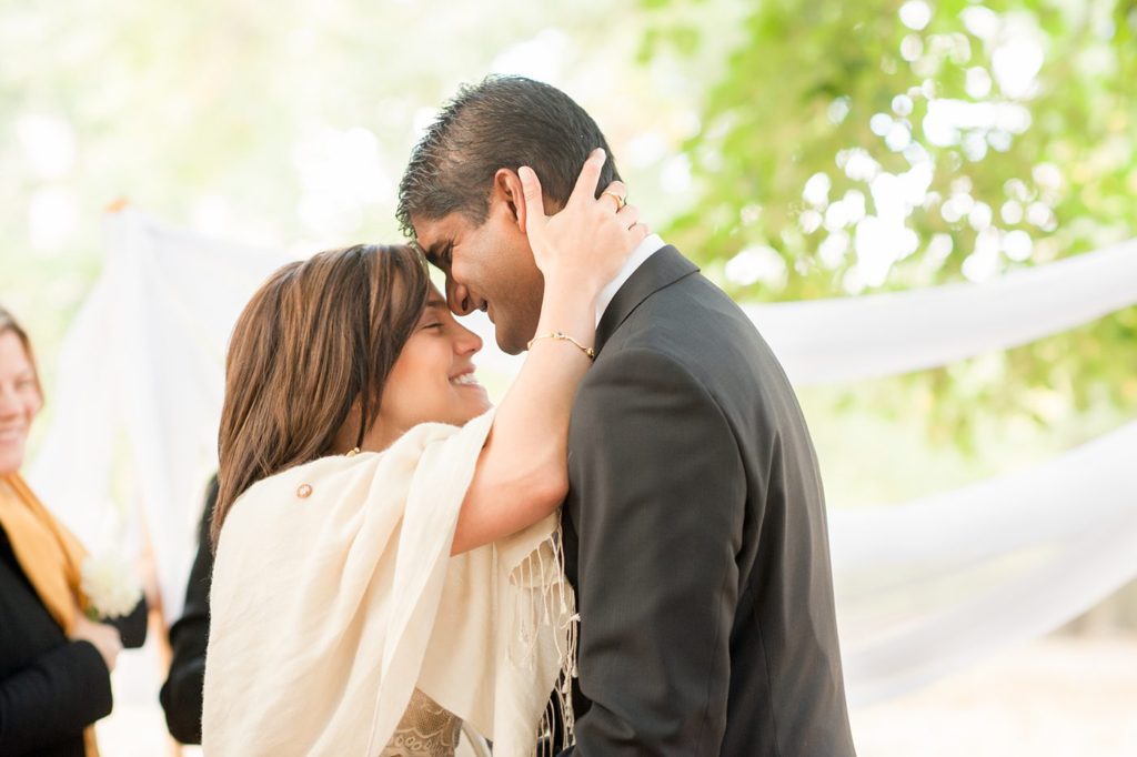 A bride and groom during their small Brooklyn wedding elopement in NYC during Fall. Photos by Mikkel Paige Photography with a ceremony held at Fort Greene Park.