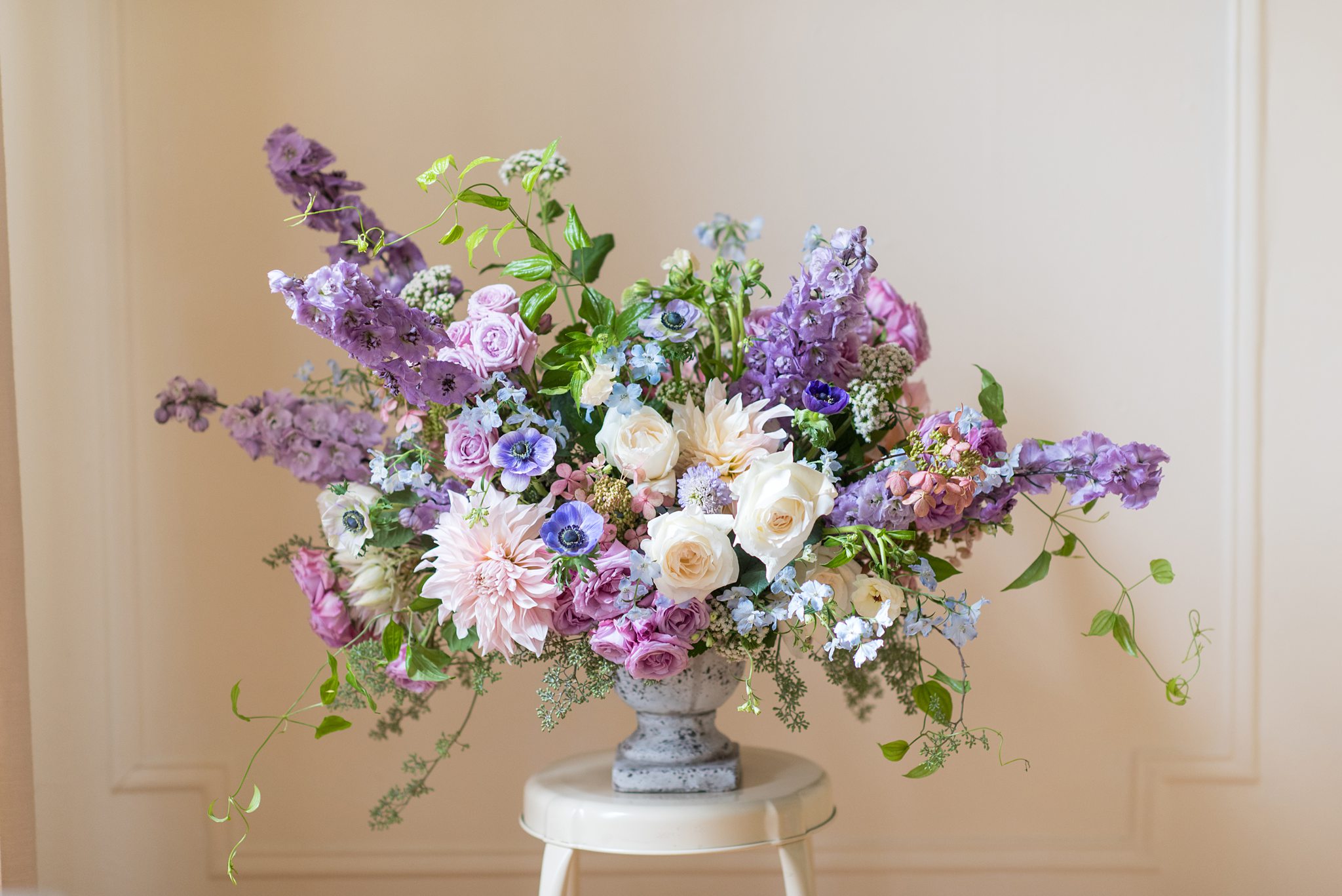 Luxury wedding photographer, Mikkel Paige Photography, detail image of a purple and pink floral arrangement by Sachi Rose Designs.