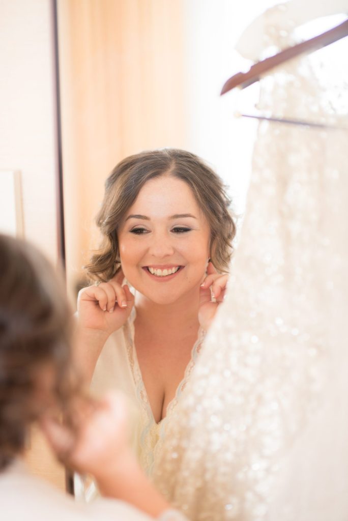 The bride prepares for her 501 Union wedding nearby at a Brooklyn hotel. Photos by Mikkel Paige Photography.