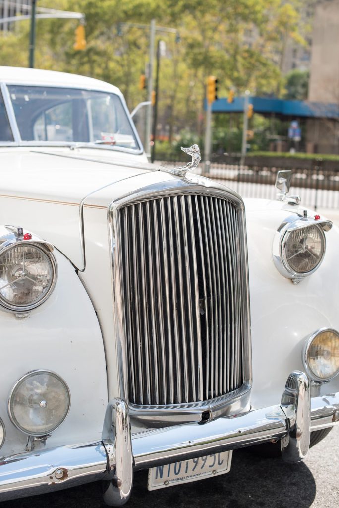 The bride transported to her 501 Union wedding in Brooklyn in a vintage white Rolls Royce. Photos by Mikkel Paige Photography.