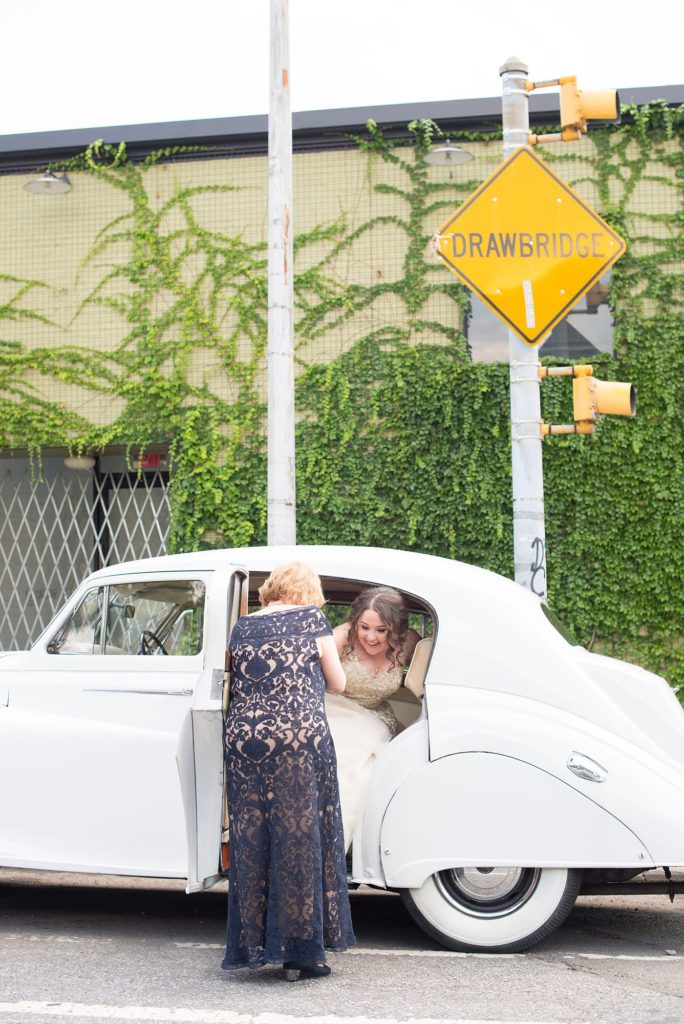 The bride transported to her 501 Union wedding in Brooklyn in a vintage white Rolls Royce with her mom. Photos by Mikkel Paige Photography.