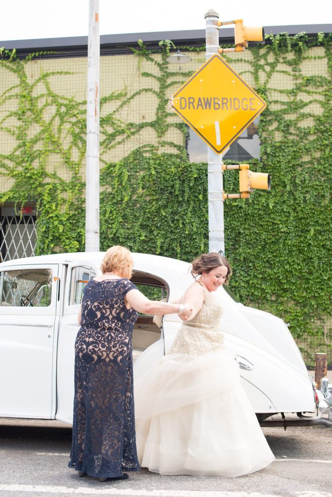 The bride transported to her 501 Union wedding in Brooklyn in a vintage white Rolls Royce with her mom. Photos by Mikkel Paige Photography.