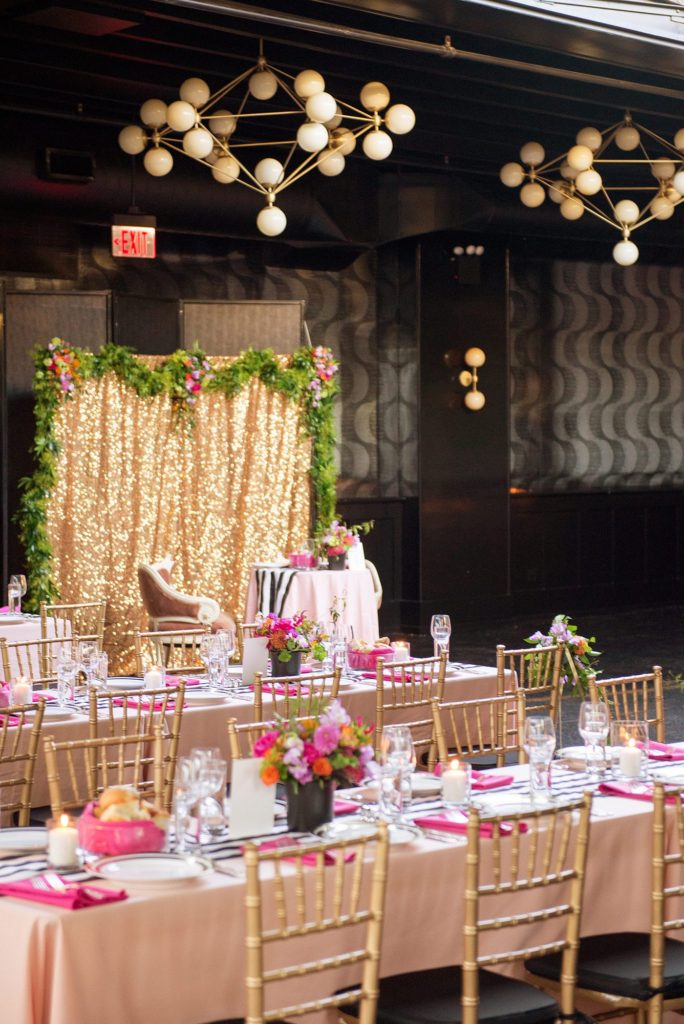 501 Union wedding with photos by Mikkel Paige Photography. The reception in Brooklyn, NY was lined with rectangular tables covered in pink linens, with vibrant flowers by August Sage and Violet and planning by Ashley Chamblin Events.