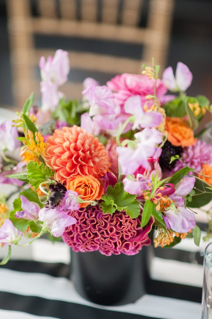 501 Union wedding with photos by Mikkel Paige Photography. The reception in Brooklyn, NY was lined with rectangular tables covered in pink linens, with vibrant flowers by August Sage and Violet and planning by Ashley Chamblin Events.