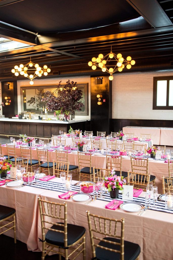 501 Union wedding with photos by Mikkel Paige Photography. The reception in Brooklyn, NY was lined with rectangular tables covered in pink linens, with vibrant flowers by August Sage and Violet and planning by Ashley Chamblin Events.