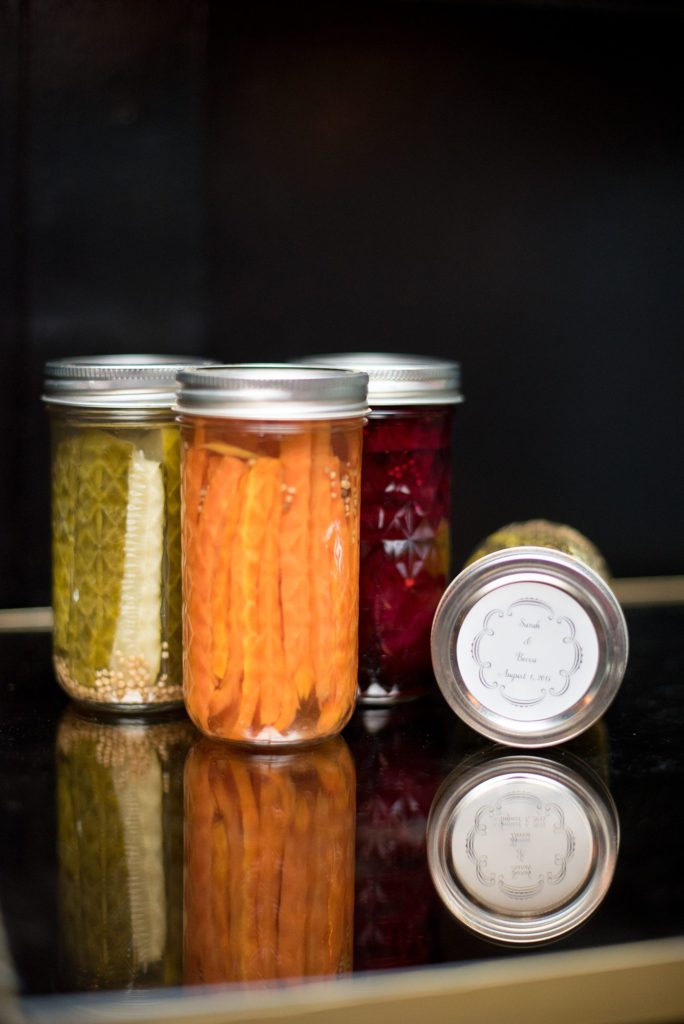 Two brides gave guests homemade pickled vegetables for a gift at their 501 Union wedding in Brooklyn, New York. Images by Mikkel Paige Photography.