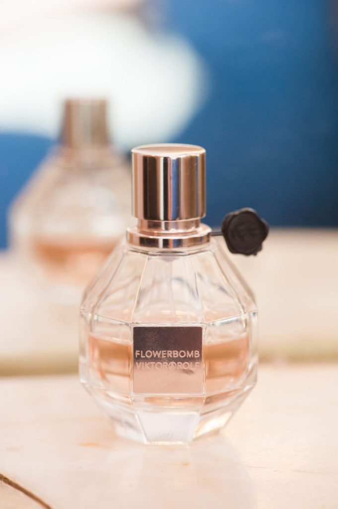 The bride applied this perfume as a final touch before her first look at her Crystal Plaza Wedding in New Jersey with photos by Mikkel Paige Photography.