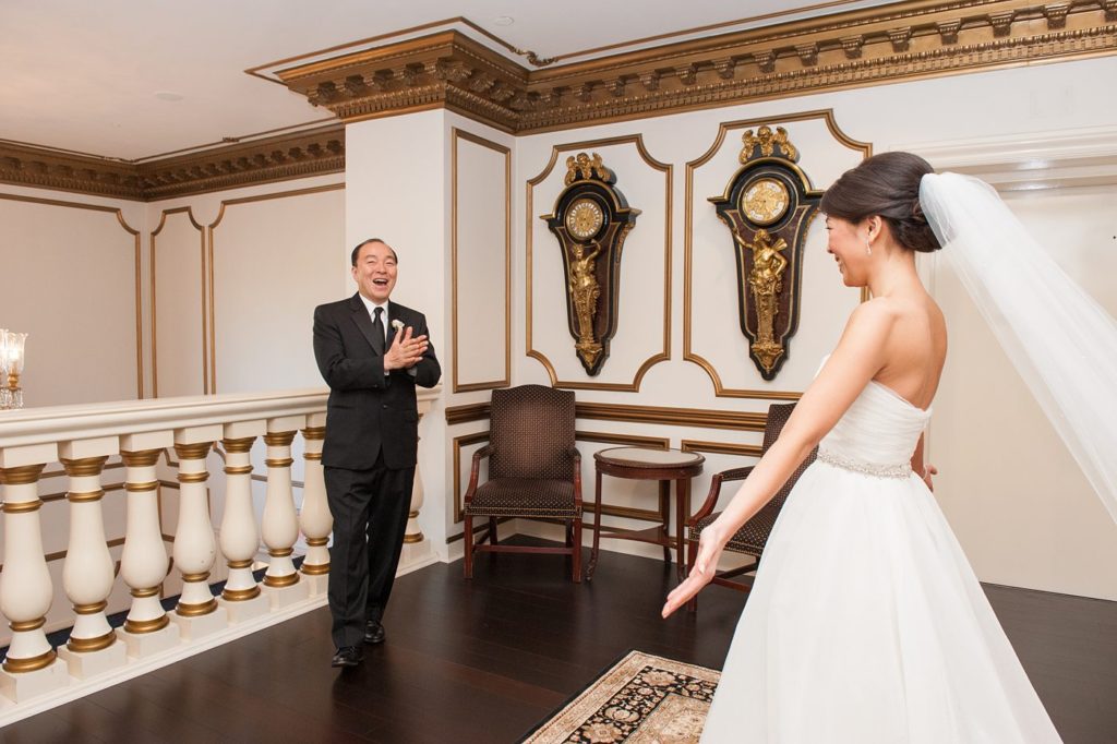 The bride had a first look with her father before seeing her groom at her Crystal Plaza Wedding in New Jersey with photos by Mikkel Paige Photography.
