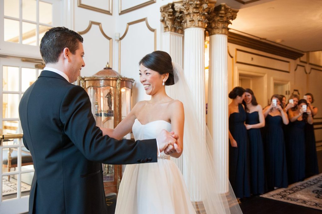 The bride and groom share their first look at their luxury wedding at Crystal Plaza in New Jersey. Photos created by Mikkel Paige Photography.