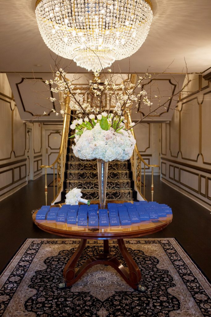 A photo of the escort card table for a luxurious January wedding at the Crystal Plaza in NJ. Photos by Mikkel Paige Photography.