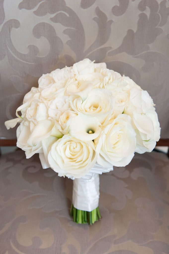 The bride's white rose bouquet for her winter wedding at Crystal Plaza in New Jersey with photos by Mikkel Paige Photography.
