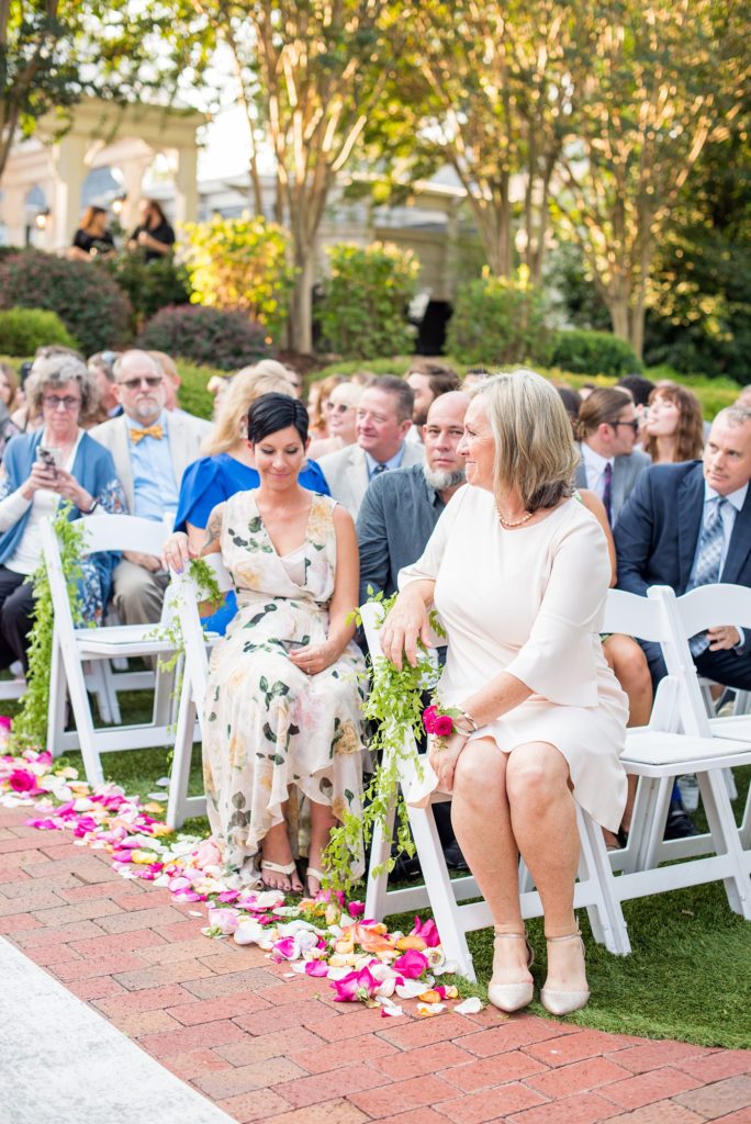 Fuquay-Varina wedding at Highgrove Estate in North Carolina with photos by Mikkel Paige Photography. The outdoor ceremony was covered in petals and flowers by Flowers on Broad Street.