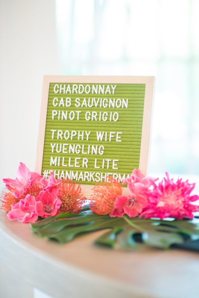 Fuquay-Varina wedding at Highgrove Estate in North Carolina with photos by Mikkel Paige Photography. Planning by A Southern Soiree. Green felt letter sign on the bar was decorated with flowers by Flowers on Broad Street.