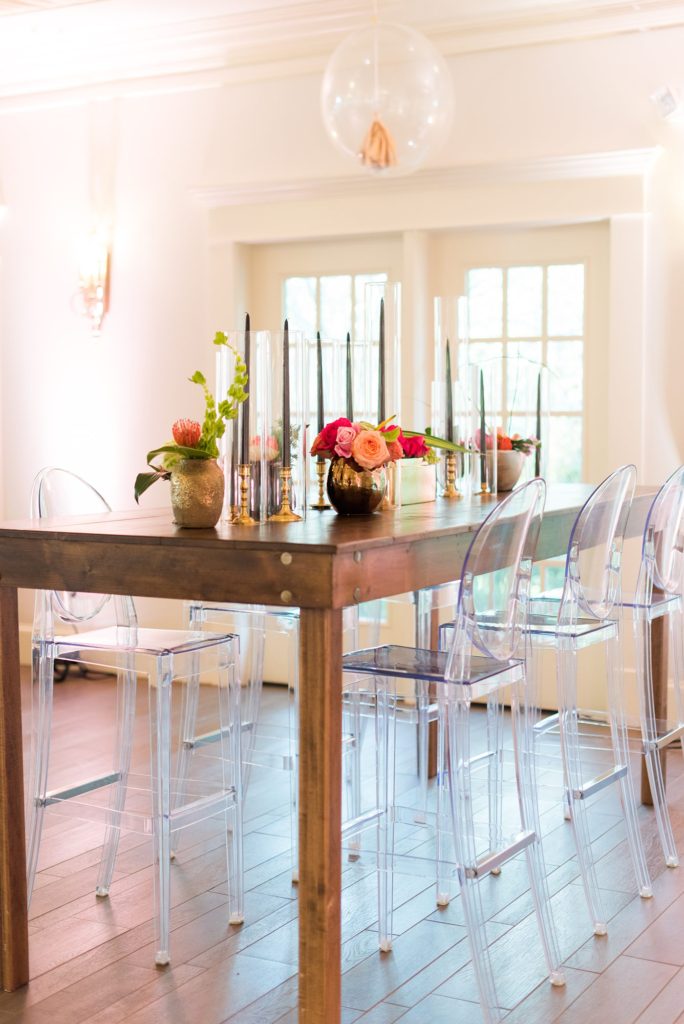 Fuquay-Varina wedding at Highgrove Estate in North Carolina with photos by Mikkel Paige Photography. Planning by A Southern Soiree. Lounge furniture rentals from Greenhouse Picker Sisters and huge balloons and tissue paper tassels adorning the ceiling.