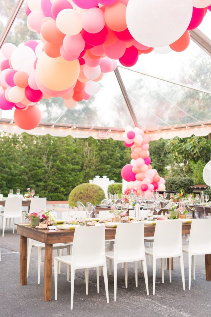 Fuquay-Varina wedding at Highgrove Estate in North Carolina with photos by Mikkel Paige Photography. Planning by A Southern Soiree. Pink and peach balloons were custom created under a clear tent.