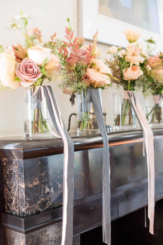 Bouquets for the bridesmaids with silk ribbons created by Bourgeon for a luxury destination wedding in the Hudson Valley in upstate New York. Photos captured by Mikkel Paige Photography and planning by The Union Studio.