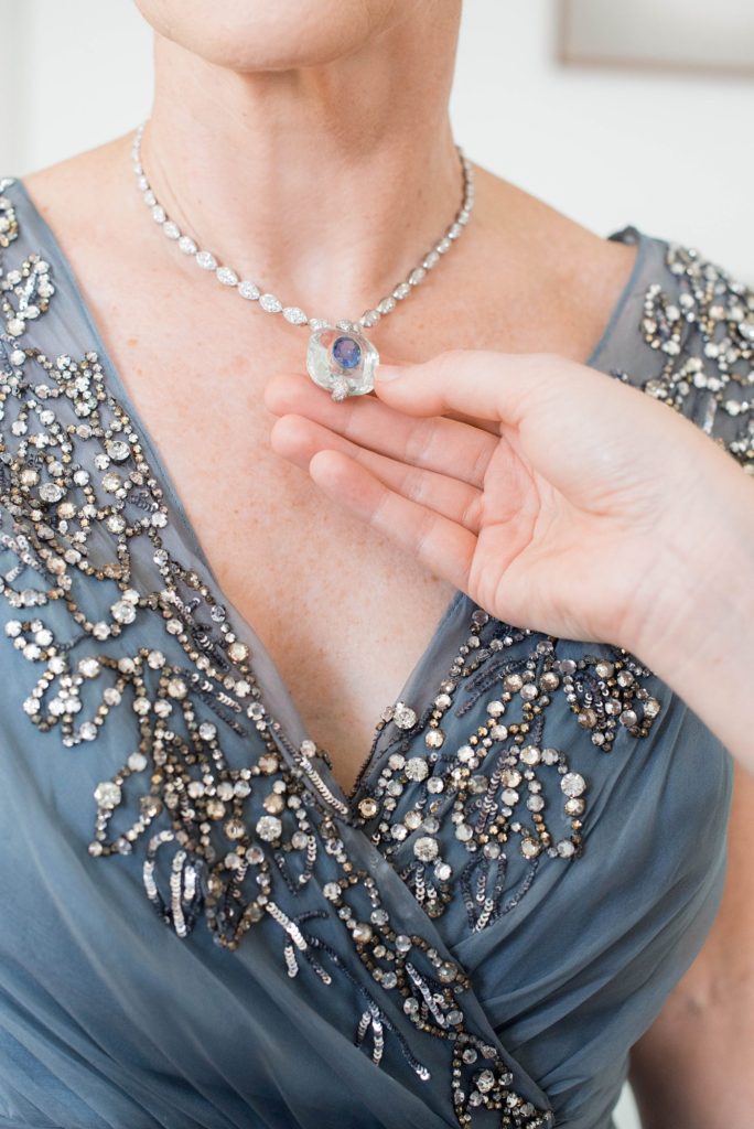 The bride's mother wore a gorgeous diamond and aqua marine necklace for her daughter's summer Hudson Valley wedding in upstate New York, photographed by Mikkel Paige Photography. Planning by The Union Studio at Southwood Estate.