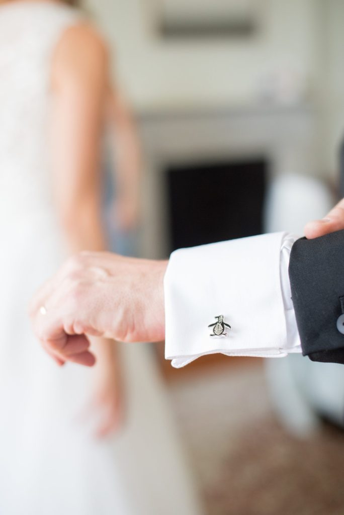 The groom and bride's father wore penguin cufflinks for a Hudson Valley wedding at Southwood Estate, photographed by Mikkel Paige Photography. Planning by The Union Studio.