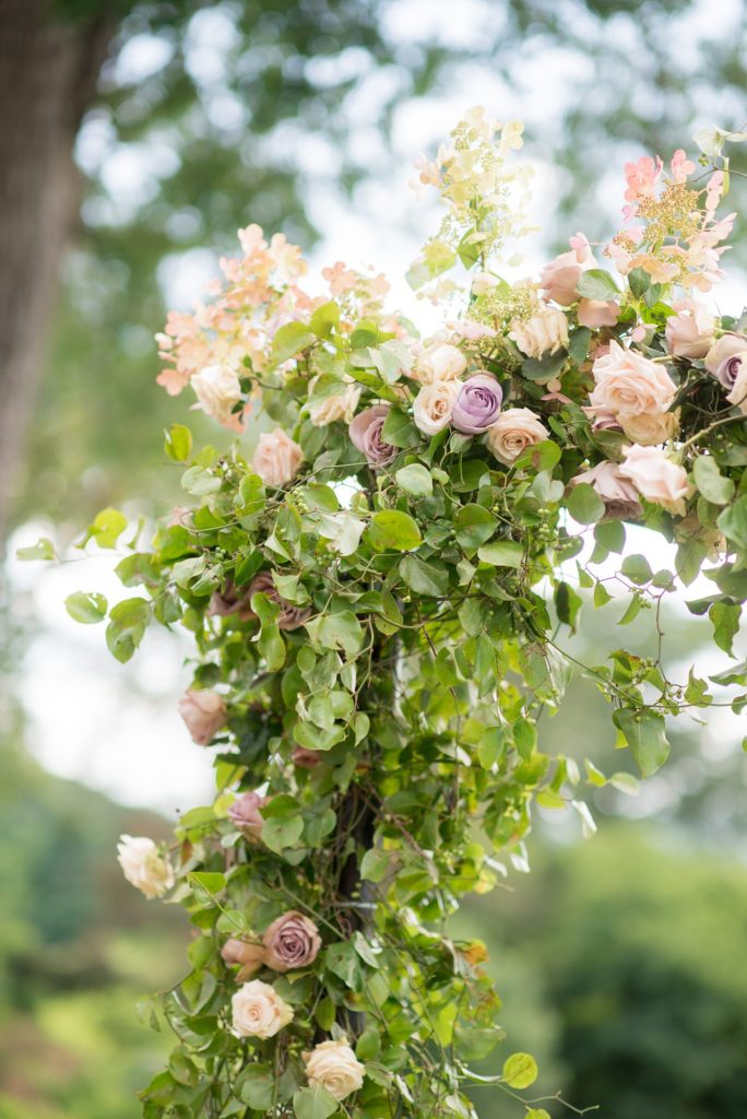 The ceremony arch for a Southwood Estate was created by Bourgeon Brooklyn florist. This Hudson Valley wedding was photographed by Mikkel Paige Photography and planned by The Union Studio.