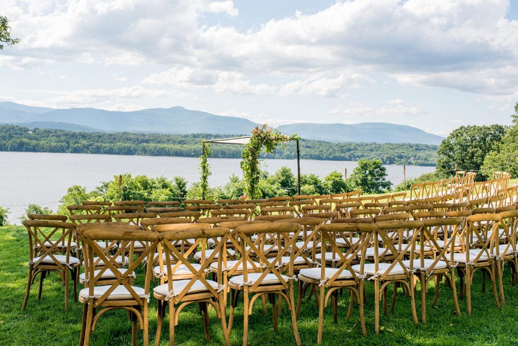 A ceremony at Southwood Estate with arch created by Bourgeon Brooklyn florist. This Hudson Valley wedding was photographed by Mikkel Paige Photography and planned by The Union Studio.