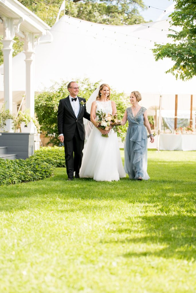 The bride's parents walked her down the aisle in front of Southwood Estate. Photos by Mikkel Paige Photography and planning by The Union Studio.