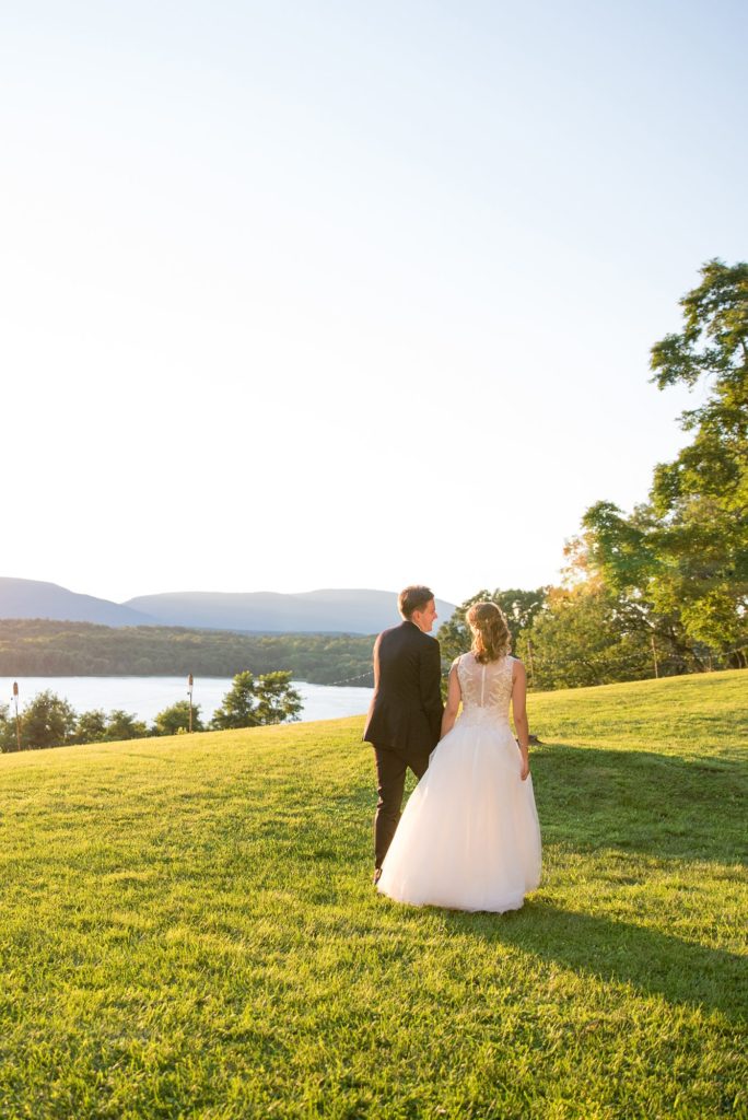 Bride and groom during golden hour captured by Mikkel Paige Photography at Southwood Estate overlooking the Hudson River in the valley, in upstate New York.