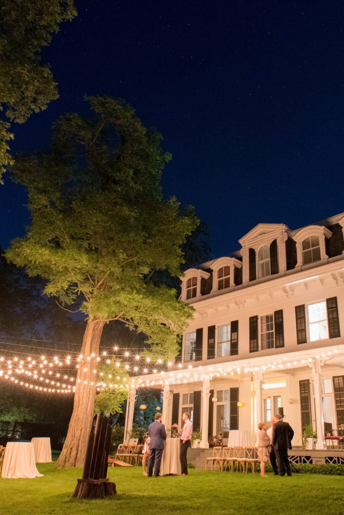 A night time photo of Southawood Estate in the Hudson Valley during a summer wedding, captured by Mikkel Paige Photography.