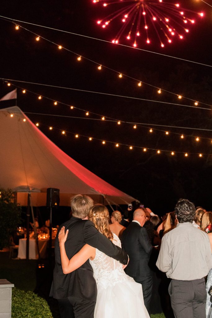 A night time photo of fireworks for a couple at their Southawood Estate wedding in the Hudson Valley, captured by Mikkel Paige Photography. Planning by The Union Studio.