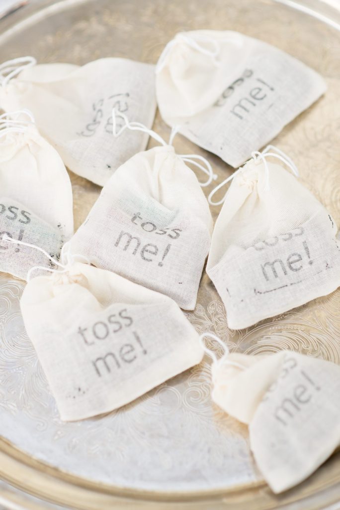 Mikkel Paige Photography captures a Prospect Park Boathouse wedding in Brooklyn, New York. The bride and groom had classic rice in 