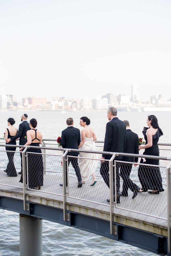 Photos of the wedding party on the New Jersey pier overlooking the NYC skyline at a W Hoboken wedding, captured by Mikkel Paige Photography.