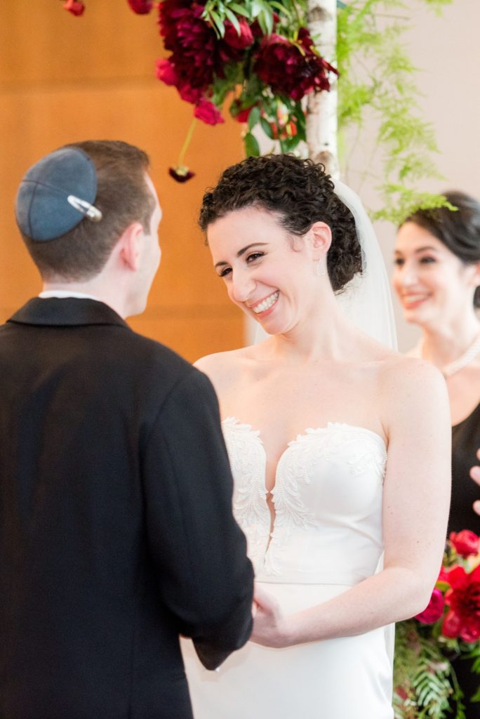 Photos of a ceremony during an April wedding by Mikkel Paige Photography of a W Hoboken wedding.