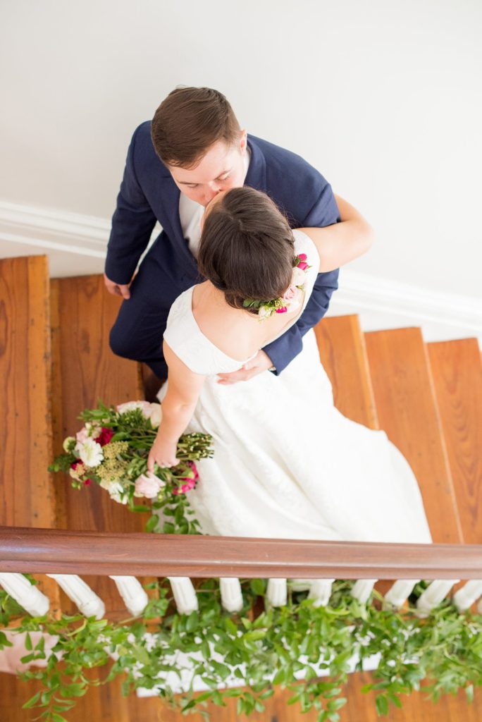 Bride and groom at their historic downtown Raleigh indoor/outdoor venue, Merrimon-Wynne House. Photographed by Mikkel Paige Photography, luxury and destination wedding photographer.