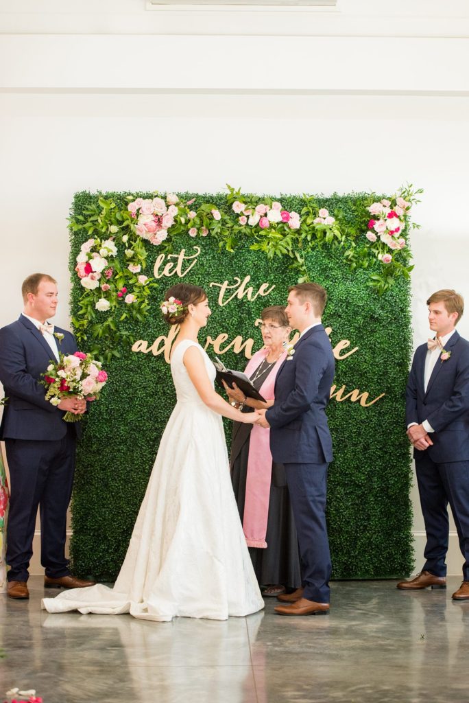 A photo of a colorful ceremony setup at Merrimon-Wynne house, captured by Mikkel Paige Photography. This downtown wedding venue in Raleigh, NC is partially indoors and outdoors.