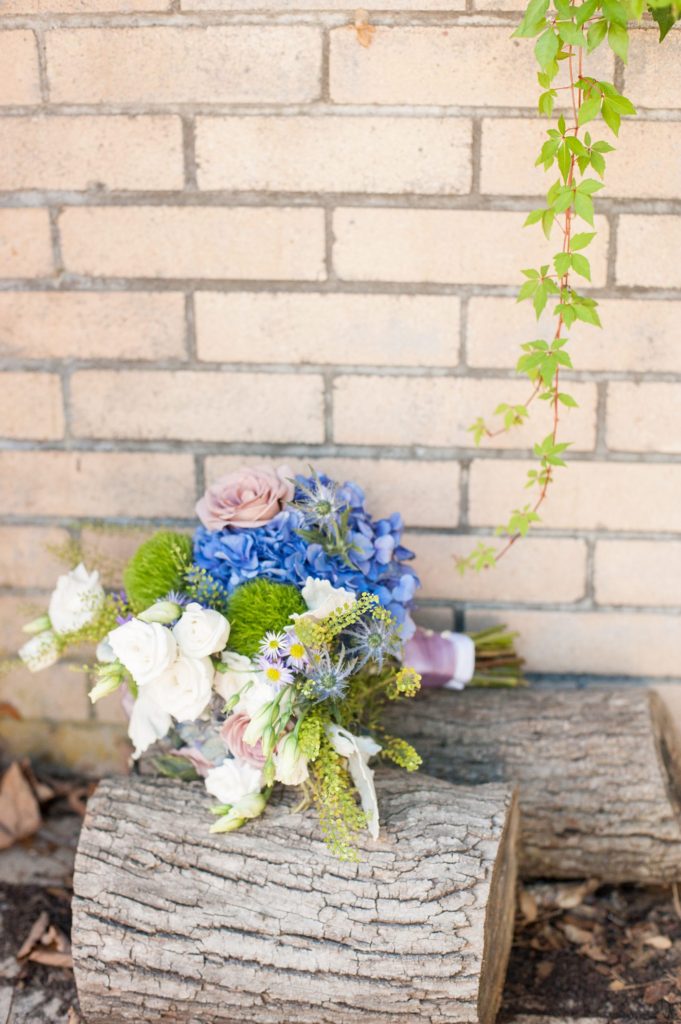 Hamptons wedding photographer captures two grooms for a same sex wedding at a private home with purple and green flowers. Images by Mikkel Paige Photography.