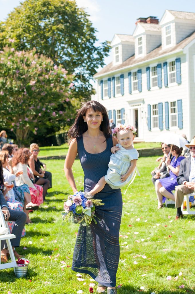 Hamptons wedding photographer captures two grooms for a same sex wedding at a private home. Outdoor ceremony images by Mikkel Paige Photography.
