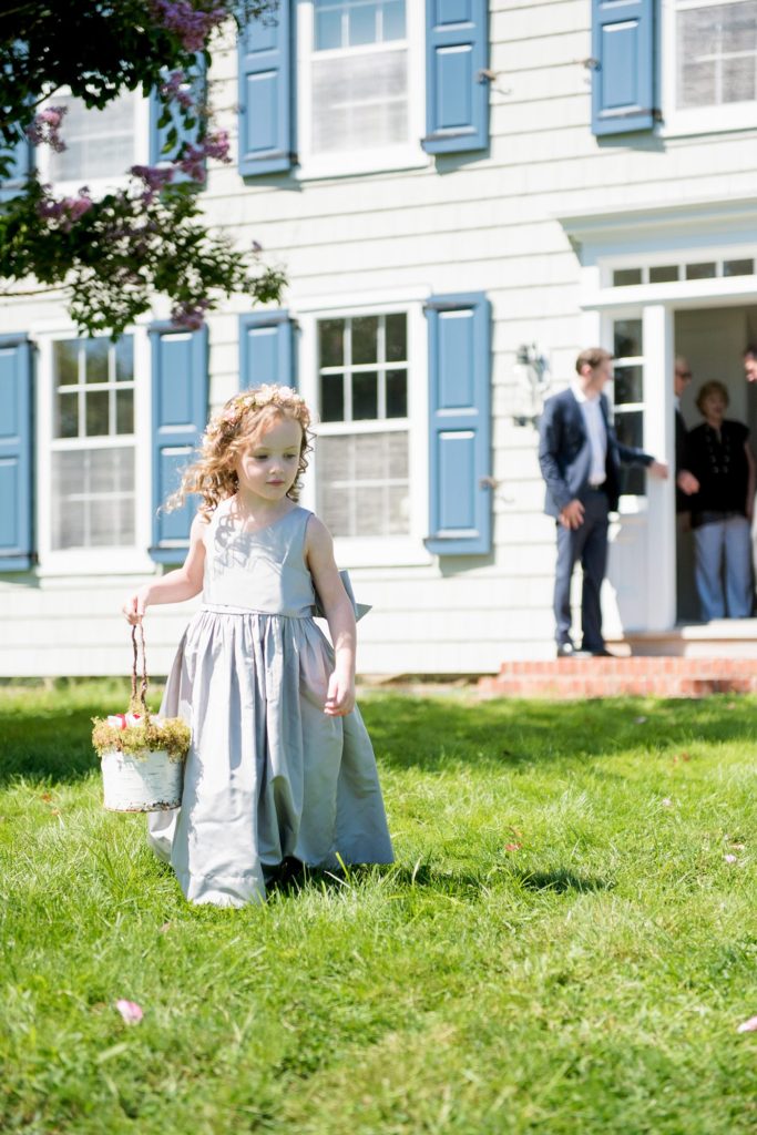 Hamptons wedding photographer captures two grooms for a same sex wedding at a private home. Outdoor ceremony images by Mikkel Paige Photography.