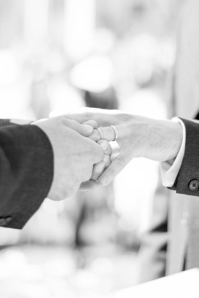 Hamptons wedding photographer captures two grooms for a same sex wedding at a private home. Outdoor ceremony images by Mikkel Paige Photography.