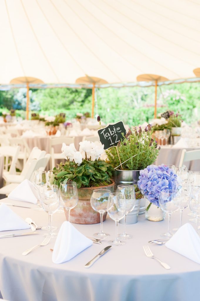 Hamptons wedding photographer captures two grooms for a same sex wedding at a private home with a tented outdoor reception. Images by Mikkel Paige Photography.