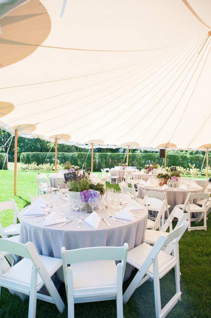 Hamptons wedding photographer captures two grooms for a same sex wedding at a private home with a tented outdoor reception. Images by Mikkel Paige Photography.