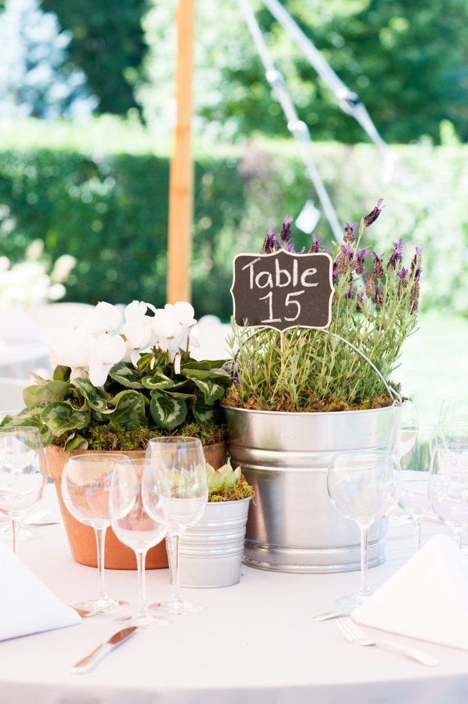 Hamptons wedding photographer captures two grooms for a same sex wedding at a private home with a tented outdoor reception. Images by Mikkel Paige Photography.