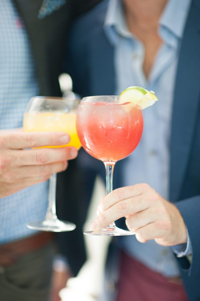 Hamptons wedding photographer captures two grooms for a same sex wedding at a private home with a tented outdoor reception. Images by Mikkel Paige Photography.