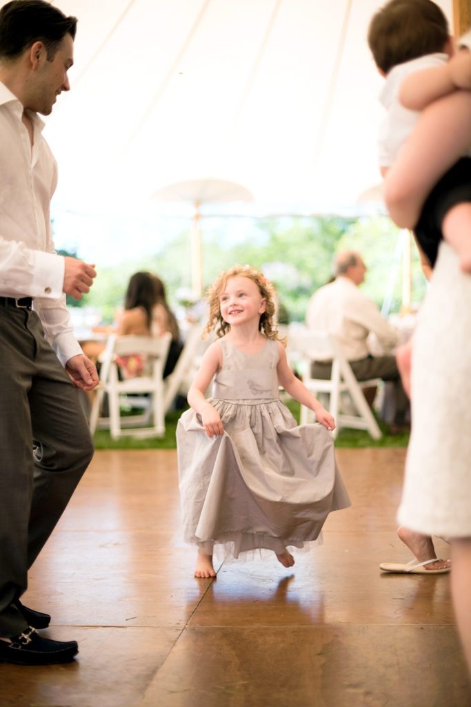 Hamptons wedding photographer captures two grooms for a same sex wedding at a private home with a tented outdoor reception. Images by Mikkel Paige Photography.