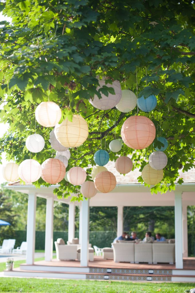 Hamptons wedding photographer captures two grooms for a same sex wedding at a private home with a tented outdoor reception. Images by Mikkel Paige Photography.