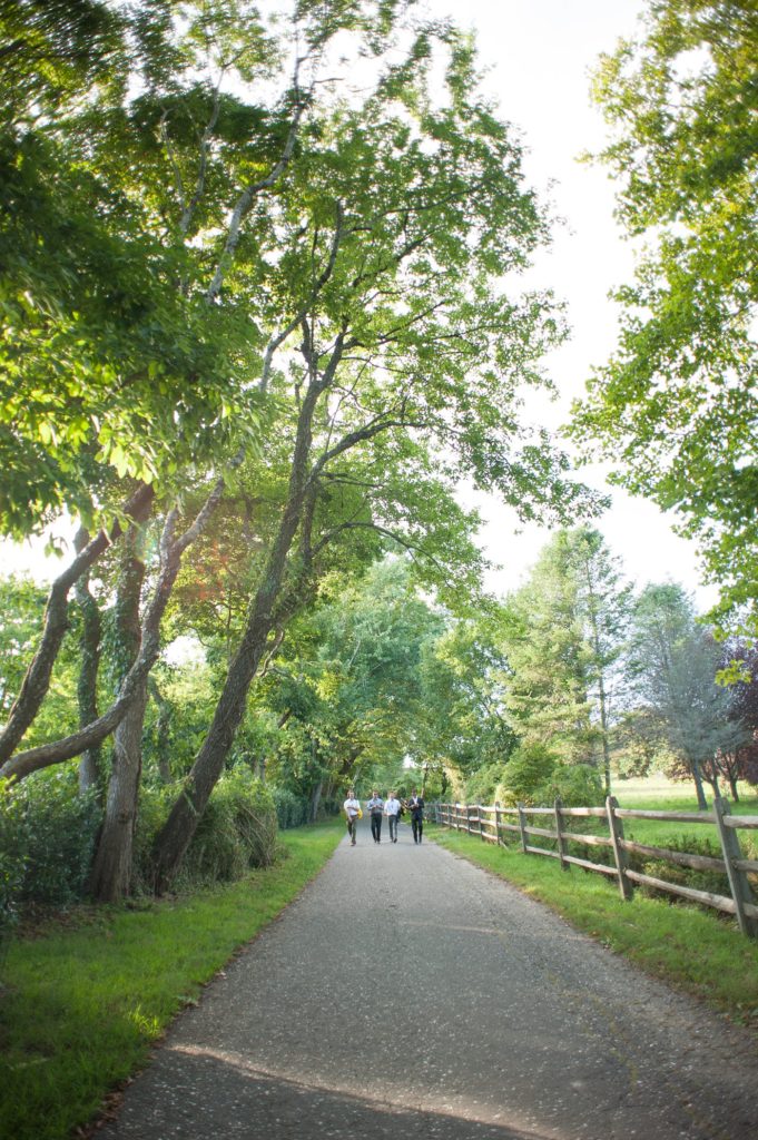 Hamptons wedding photographer captures two grooms for a same sex wedding at a private home with a tented outdoor reception. Images by Mikkel Paige Photography.